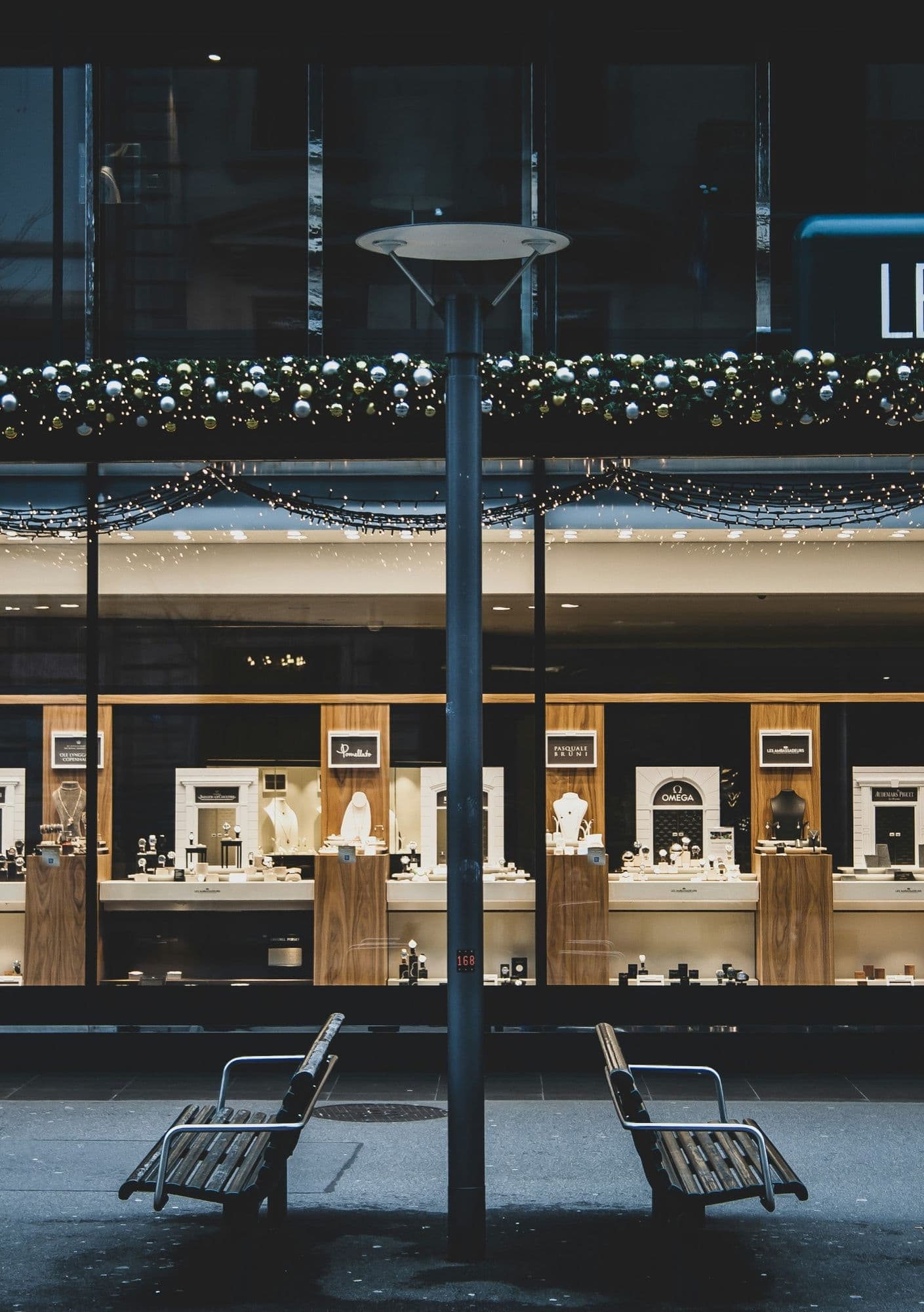 A jeweller’s window display lit at night